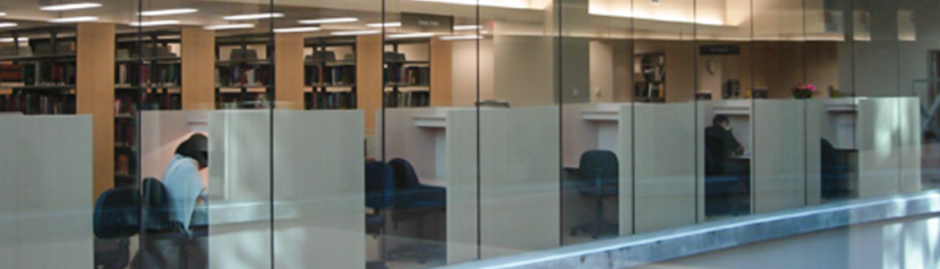 Photo outside the Biomedical Branch library showing study areas and book stacks